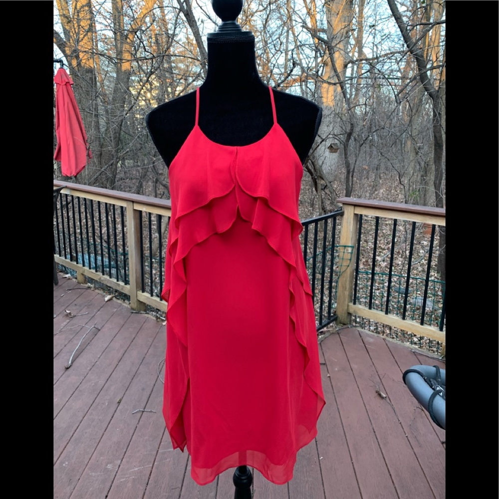 BCBG red ruffled dress with crisscross straps.